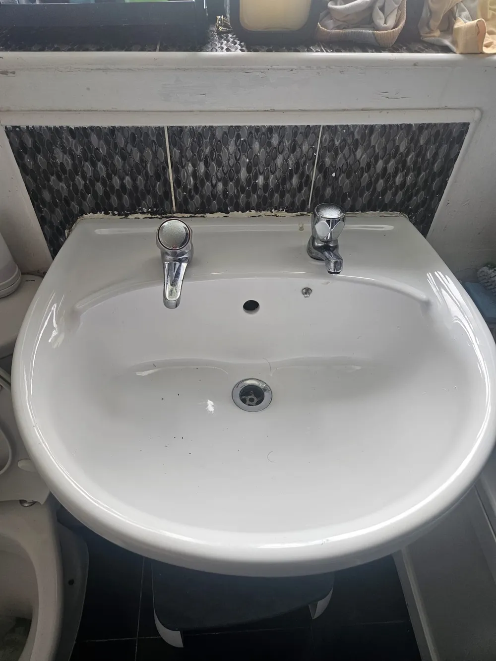 Bathroom basin taps that had been dripping, repaired and refitted by First Call Home Services