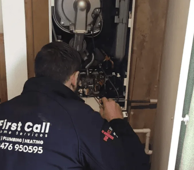 First Call Home Services engineer inspecting a boiler