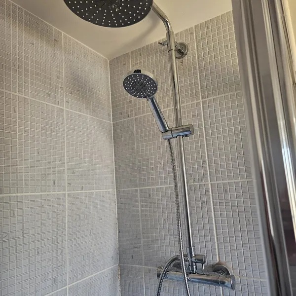 Matte black rainfall shower fitted in a Coventry bathroom